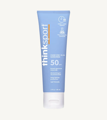 Blue tube of thinksport sunscreen on a white background